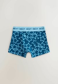 Boxers bleus pour garçons avec motif étoiles bleu clair et ceinture bleu clair comportant le texte répété "NEXT".