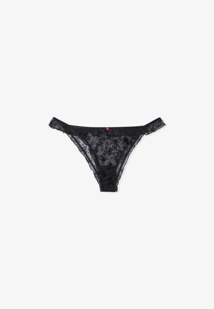 Black lace thong with floral embroidery, sheer design, and a pink decorative accent on the front. Features thin straps and soft texture.