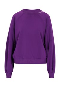 Lilla sweatshirt med en afslappet pasform, raglanærmer og ribbet halsudskæring. Har en diskret logo detalje på skulderen. Glat tekstur.