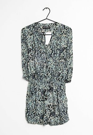 Floral romper with long sleeves, black background, and light blue and white flower patterns. Features a keyhole neckline and elastic waist.