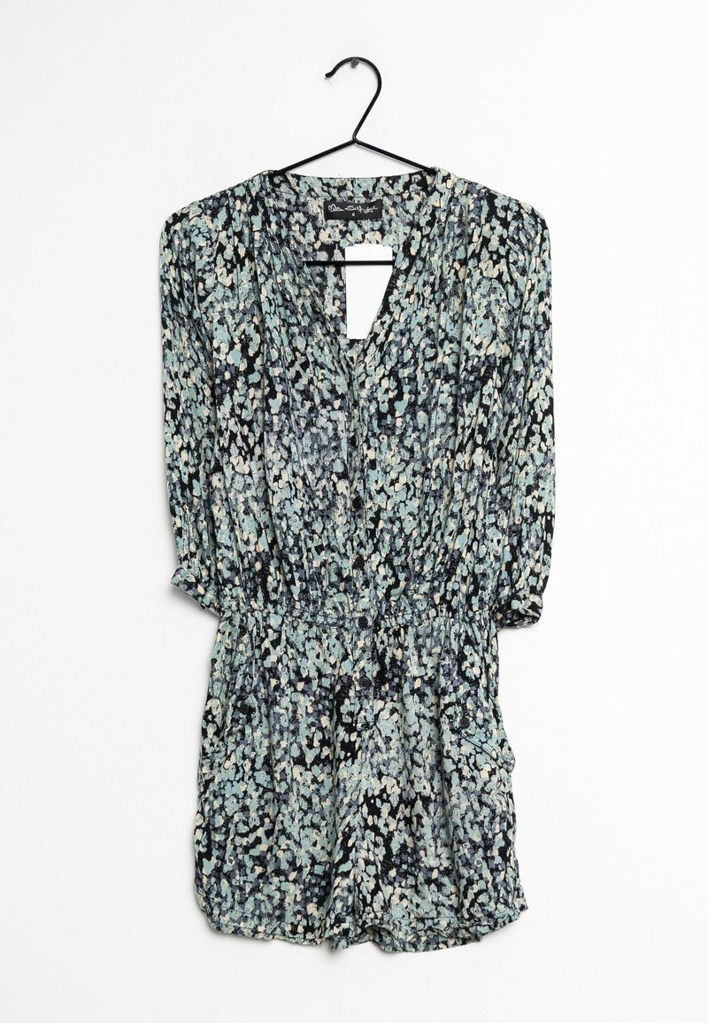 Blommig rompertopp med långärmar, svart bakgrund och mönster av ljusblå och vita blommor. Har en nyckelhålsöppning vid halsen och elastisk midja.