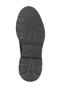Semelle de chaussure en caoutchouc noir avec des motifs et le nom de la marque "Sioux" embossé près du centre.