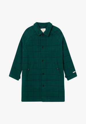 Grüner Wollmantel mit nautischem Karomuster, fünfknöpfiger Verschluss, zwei Seiten Taschen und einem spitzen Kragen. Raglanärmel mit einer lockeren Passform.