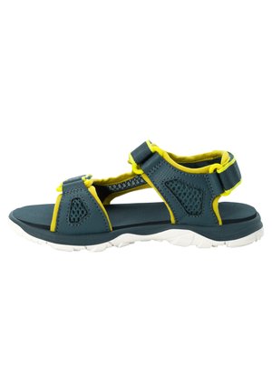 Teal and yellow sandal featuring mesh accents, adjustable straps, and a white rubber sole with textured tread for grip.
