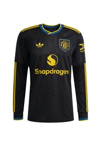 Black long-sleeve jersey with yellow and blue accents, featuring the Manchester United logo, SnapDragon branding, and three-stripe design.