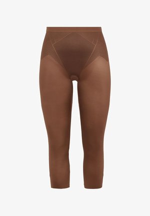 Leggings marroni a vita alta con una texture liscia e motivi geometrici sulle cosce, caratterizzati da un design aderente e una lunghezza cropped.