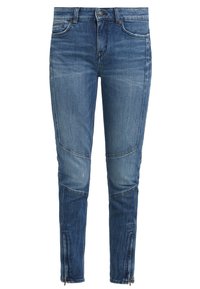 Úzké džíny od světle modré po tmavě modrou denim, s kolenními nášivkami, přiléhavým siluetem, zipovými lemy a tradičním designem s pěti kapsami.