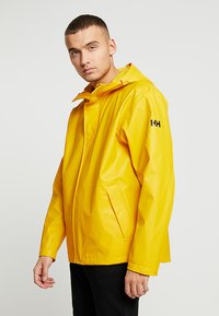 Helly Hansen - MOSS JACKET - Regenjacke / wasserabweisende Jacke - yellow Thumbnail-Bild 1