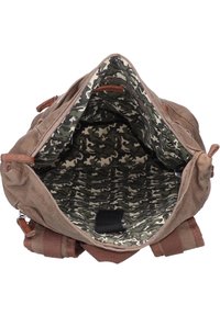 Brown canvas bag with leather accents, featuring a camouflage-patterned interior lining and a spacious main compartment.