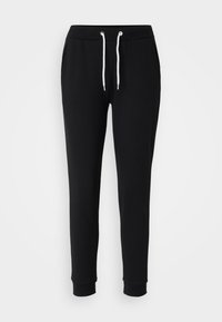 Pantalon de jogging noir slim fit avec taille élastique, cordon blanc, poches latérales et ourlets côtelés aux chevilles sur fond uni.