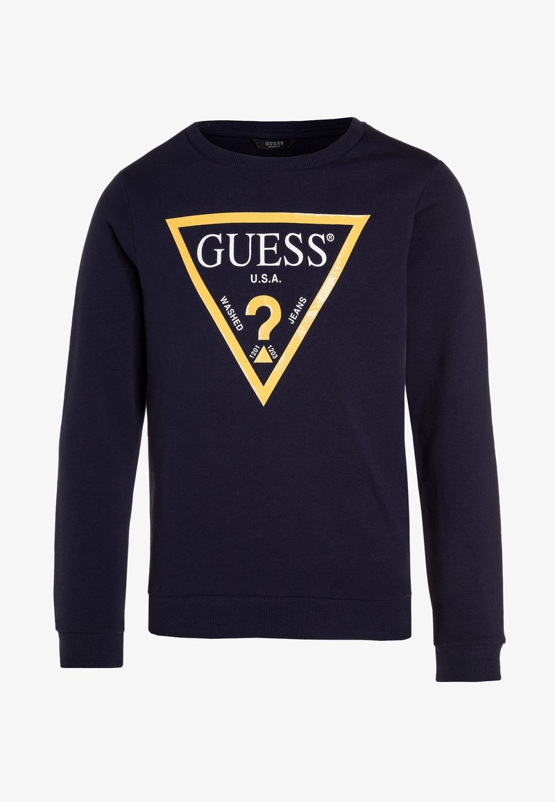 Sweat-shirt bleu marine à manches longues avec un grand logo jaune en forme de triangle indiquant "GUESS U.S.A." et un point d'interrogation au centre.