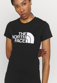 The North Face EASY - Potiskana majica - black