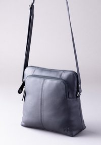 Leather crossbody bag in dark gray, featuring a zippered main compartment, front pocket, and adjustable strap, with stitching details.