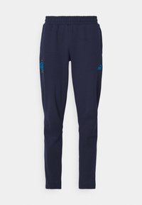 Navy sweatpants with an elastic waistband, two side pockets, and a blue Puma logo on the left leg. Soft fabric with a smooth texture.