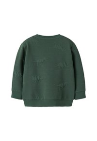 Sweatshirt vert avec un motif texturé de silhouettes de dinosaures. Encolure et poignets côtelés, tissu doux avec un design en nid d'abeille subtil.