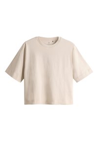 T-shirt beige oversize à manches courtes, col rond et coupe ample, présenté sur fond blanc.