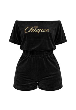Black off-shoulder velvet romper with elastic waist and gold "Chique" text and diamond graphic across the chest.