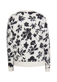 Blütenmuster-Pullover in Creme mit marineblauen Akzenten. Er verfügt über lange Ärmel, einen runden Halsausschnitt sowie gerippte Bündchen und Saum.