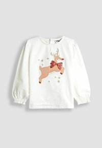 Fehér, hosszú ujjú gyermeking, amelyen egy ugráló rénszarvas hímezve látható, piros flitteres masnival, körülötte pedig kisebb aranycsillagokkal.