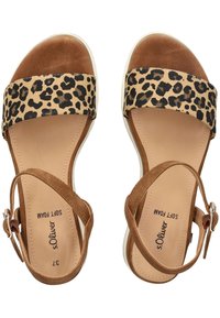 Brown platform sandals featuring a leopard print wide strap, soft foam insole, adjustable ankle strap, and white rubber sole.