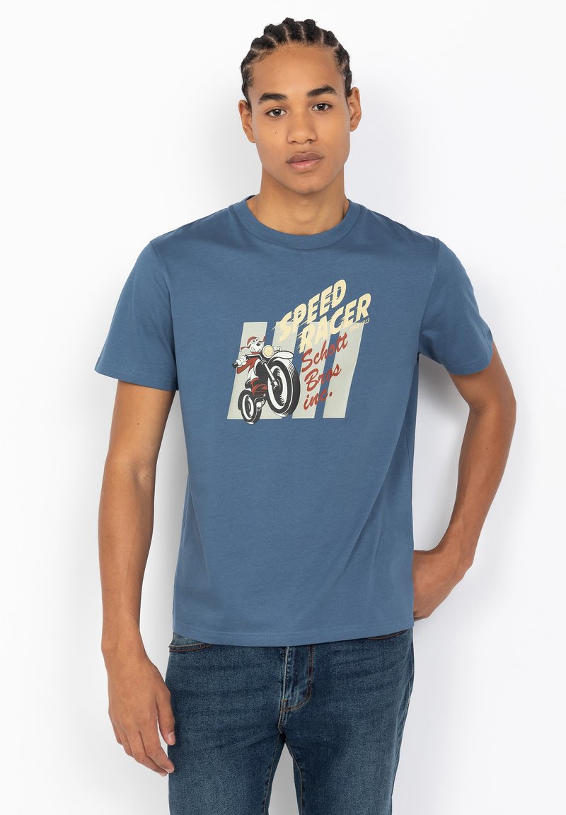 T-shirt bleu à manches courtes en coton, avec un graphique de dessin animé d'un coureur. Col rond et coupe regular.