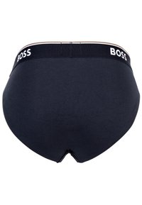 Slip neri in cotone con un ampio elastico in vita caratterizzato dal logo "BOSS" in bianco, texture liscia e design a taglio classico.