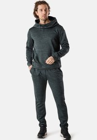 Dark gray athletic hoodie with a front pocket, drawstring hood, and matching joggers. Both feature a textured, heathered fabric.