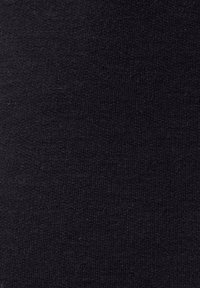 Black knitted textile featuring a smooth, consistent texture with a fine ribbing pattern. No notable details or hardware are present.