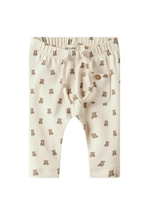 Cremefarbene Babypants mit braunem Teddy-Bären-Druck, elastischem Bund, Zugband und kleiner Fronttasche mit Knopfdetail.