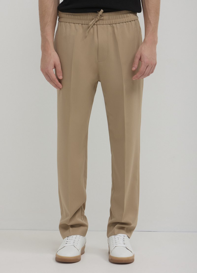 Calliope JOGGER - Stoffhose - beige