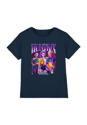 Navy blue T-shirt featuring three animated female characters with colorful outfits under the word "HUNTRX" and "KPOP Demon Hunters" text.