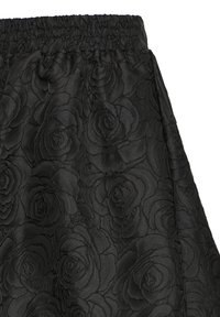 Black skirt with a textured rose pattern, featuring an elastic waistband and smooth fabric. The design emphasizes intricate floral embossing.