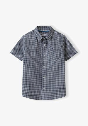 Rövidujjú, gombos ing tengeri kék és fehér kockás mintával. Mellzsebe van és hajtott gallérral rendelkezik. Könnyű anyagból készült.