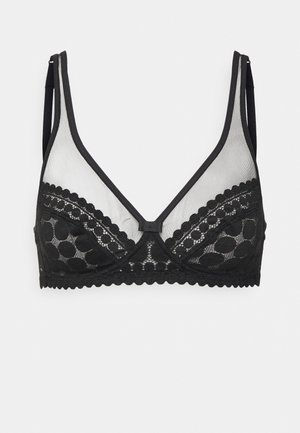 Reggiseno nero a forma triangolare, in tessuto a rete, con dettagli in pizzo e bordi ondulati. Presenta spalline regolabili e dettagli a pois.