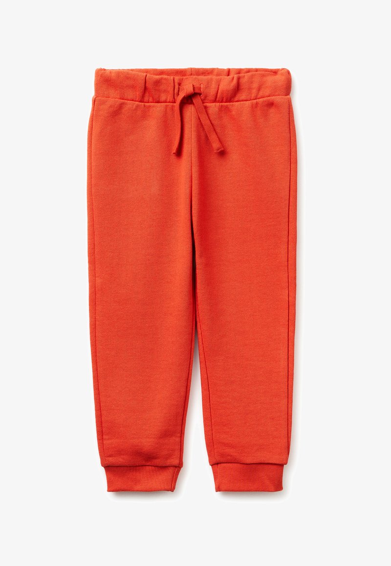 Pantalones deportivos infantiles de color naranja brillante con cintura elástica, cordón y puños acanalados, colocados planos sobre fondo blanco.