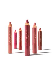 Five lip crayons in varying shades of pink and red. Cylindrical design with wooden tips and gold lettering on the casing. Smooth texture.