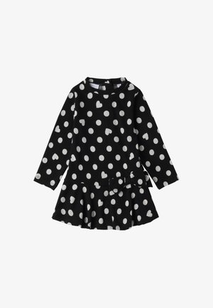 Zwarte lange mouw jurk met witte stippen en hartpatronen, met een uitlopende rok en een strikaccent op de taille.