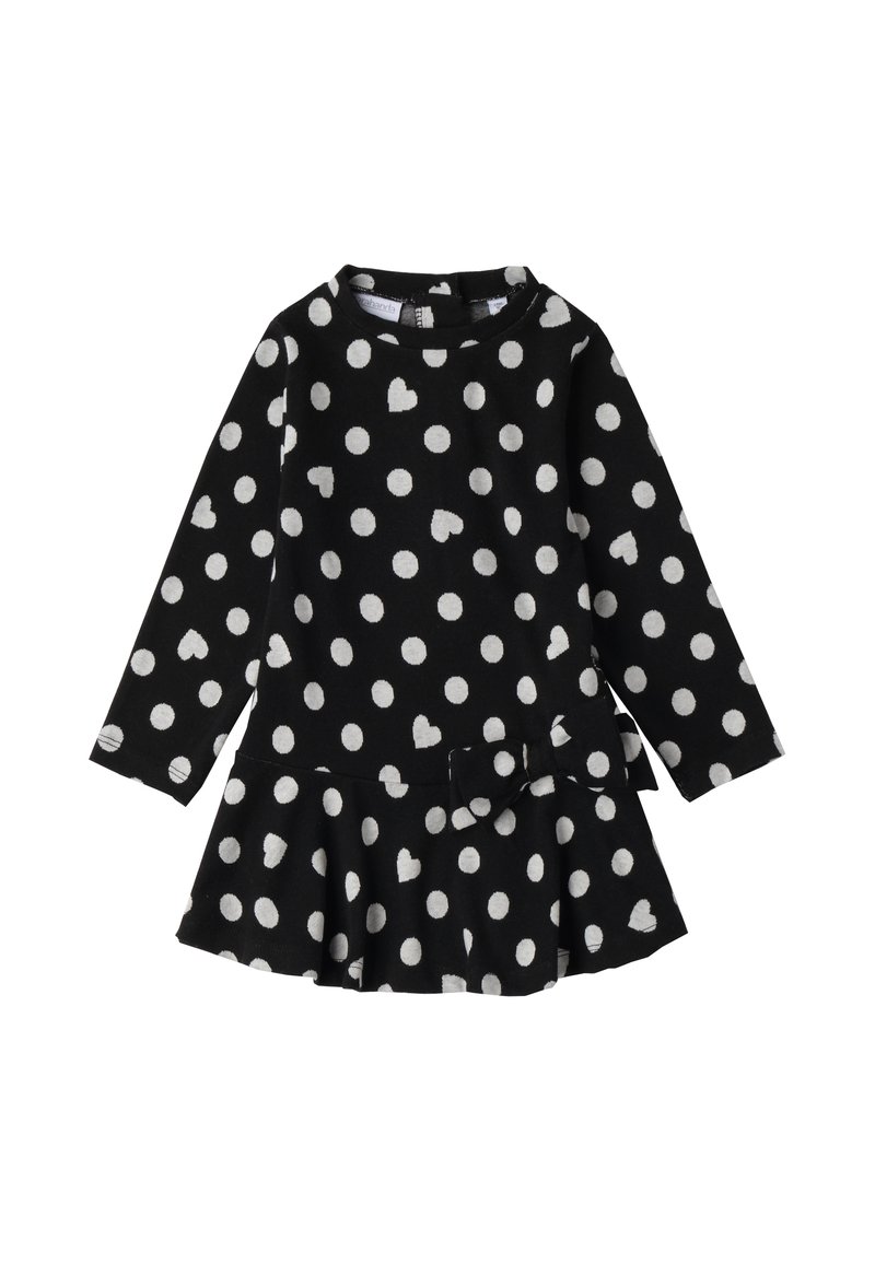 Czarna sukienka z długim rękawem, w białe kropki i wzory serc, z rozkloszowaną spódnicą i kokardą w talii.