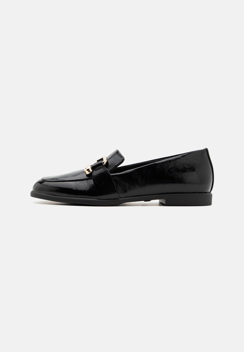 Black patent leather loafers with a flat heel, featuring a prominent strap and gold-tone hardware, smooth texture, and classic design.