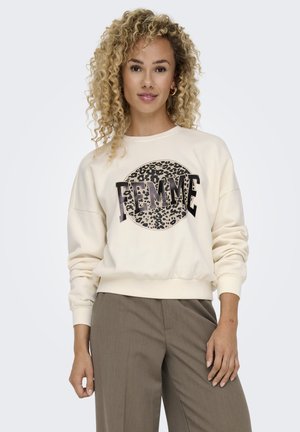 Light cream sweatshirt with a round leopard print 'FEMME' graphic. Features ribbed cuffs and hem, relaxed fit, soft cotton blend fabric.