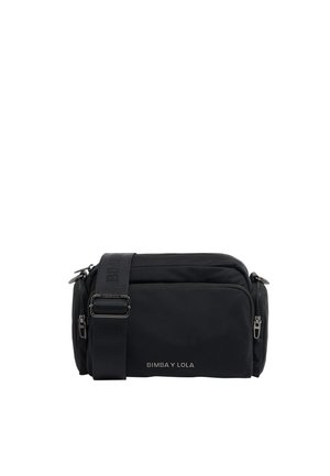 Black nylon crossbody bag with two zippered compartments. Features adjustable strap, embossed logo, and smooth texture for a sleek design.