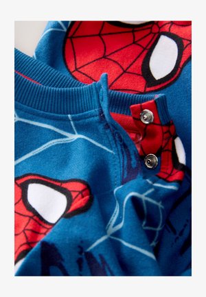 Sinise fliisist pidžaama punase Spider-Man kujundusega, millel on soonikuga krae ja läikiva hõbedase viimistlusega trukid.