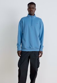 New Balance ATHLETICS 1/2 ZIP - Športni pulover - heron blue