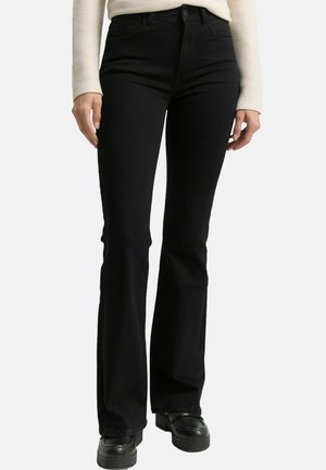 Schwarze Jeans in ausgestelltem Schnitt mit hoher Taille, aus Denim gefertigt. Verfügt über Taschen vorne und hinten, Gürtelschlaufen sowie eine glatte, strukturierte Oberfläche.