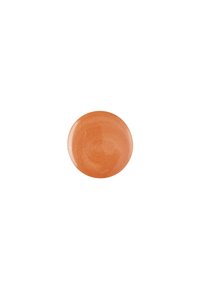 Kremet bronse sminkeprodukt i en sirkelform med en jevn, blank finish og subtil glans. Fargen er varm oransje-brun.