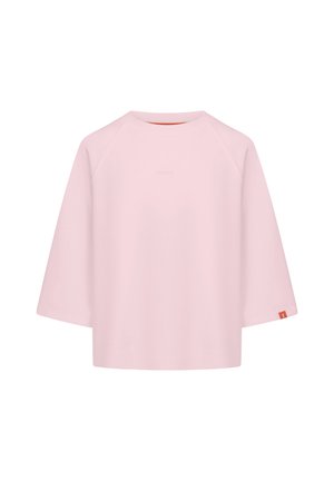 Lichtroze oversized t-shirt van zachte stof, met een ronde halslijn, 3/4 raglanmouwen en een klein logo op de voorkant.