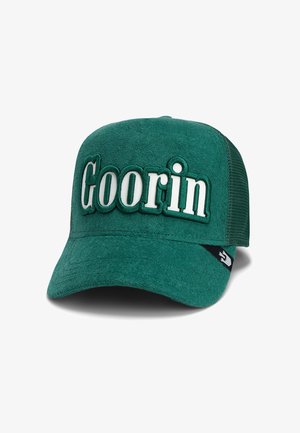 Green baseball cap with white embroidered "Goorin" on the front. Soft fabric front, mesh back, curved brim, and side logo accent.