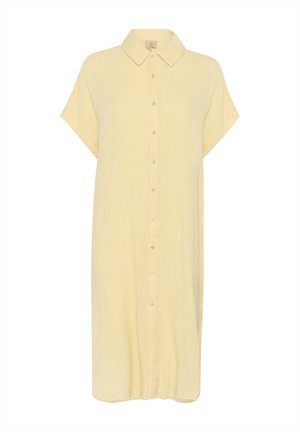 Vestido camisero amarillo con cuello, mangas cortas y corte holgado. Está hecho de una tela ligera y texturizada. Presenta un dobladillo recto.