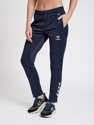 HMLCORE  - Tracksuit bottoms - marine