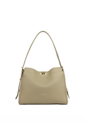 Beige leather handbag with a smooth texture, a curved top, a gold clasp closure, and an adjustable shoulder strap.